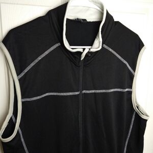 The black activewear vest with grey trim and white accents. Full front zip sizeL